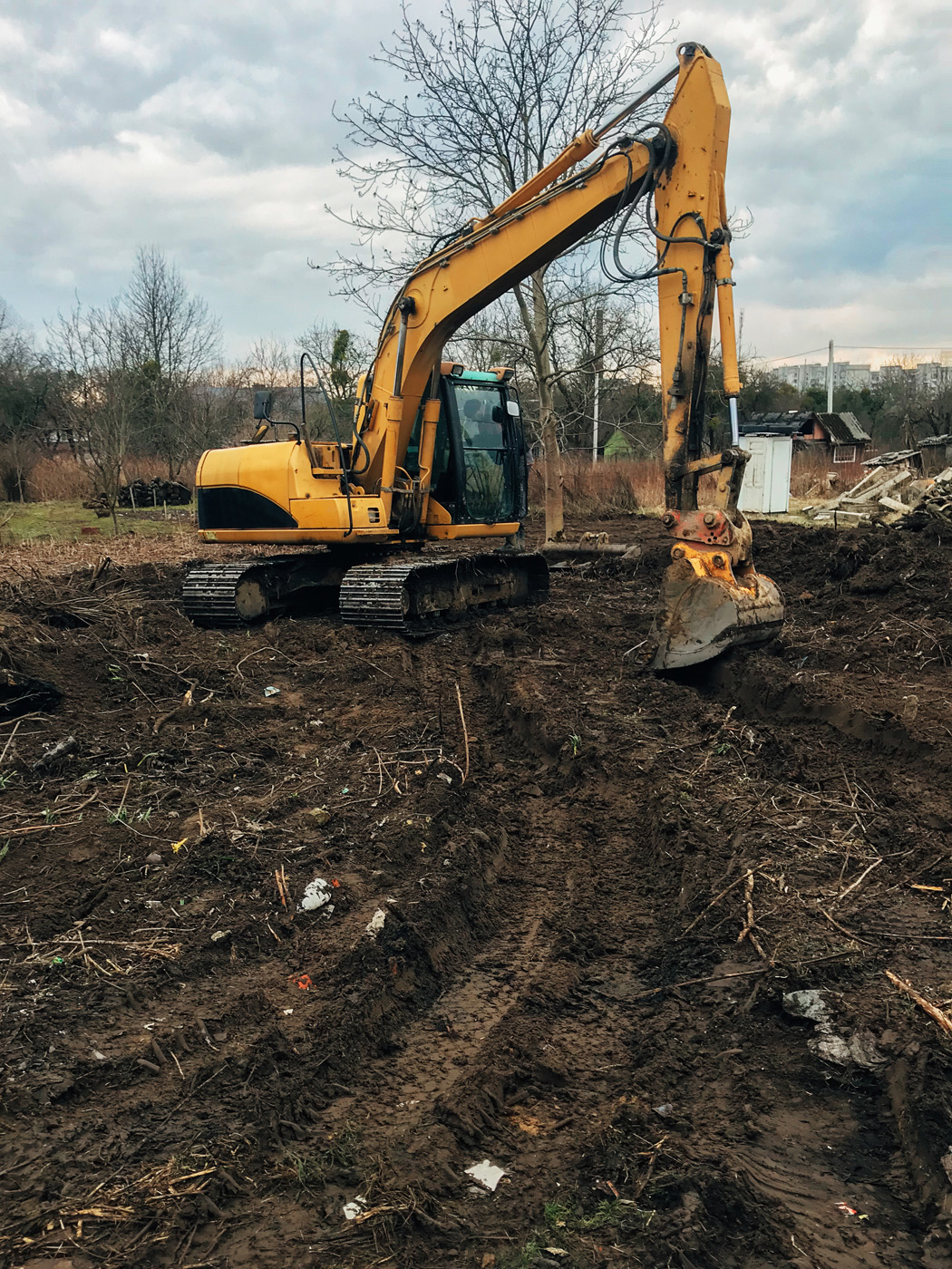 bulldozer-clearing-land-from-old-trees-roots-and-branches-with